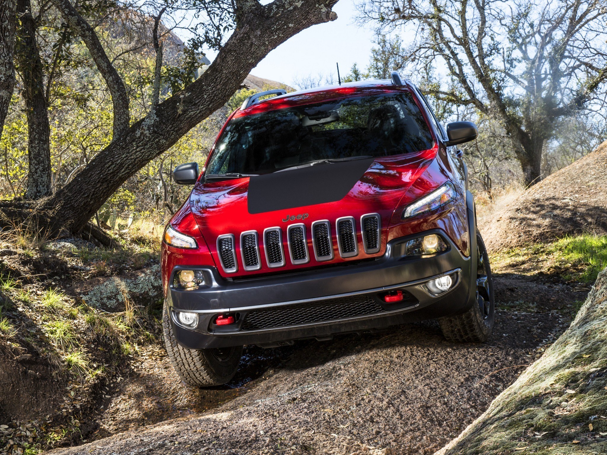 Red Jeep Cherokee on trail