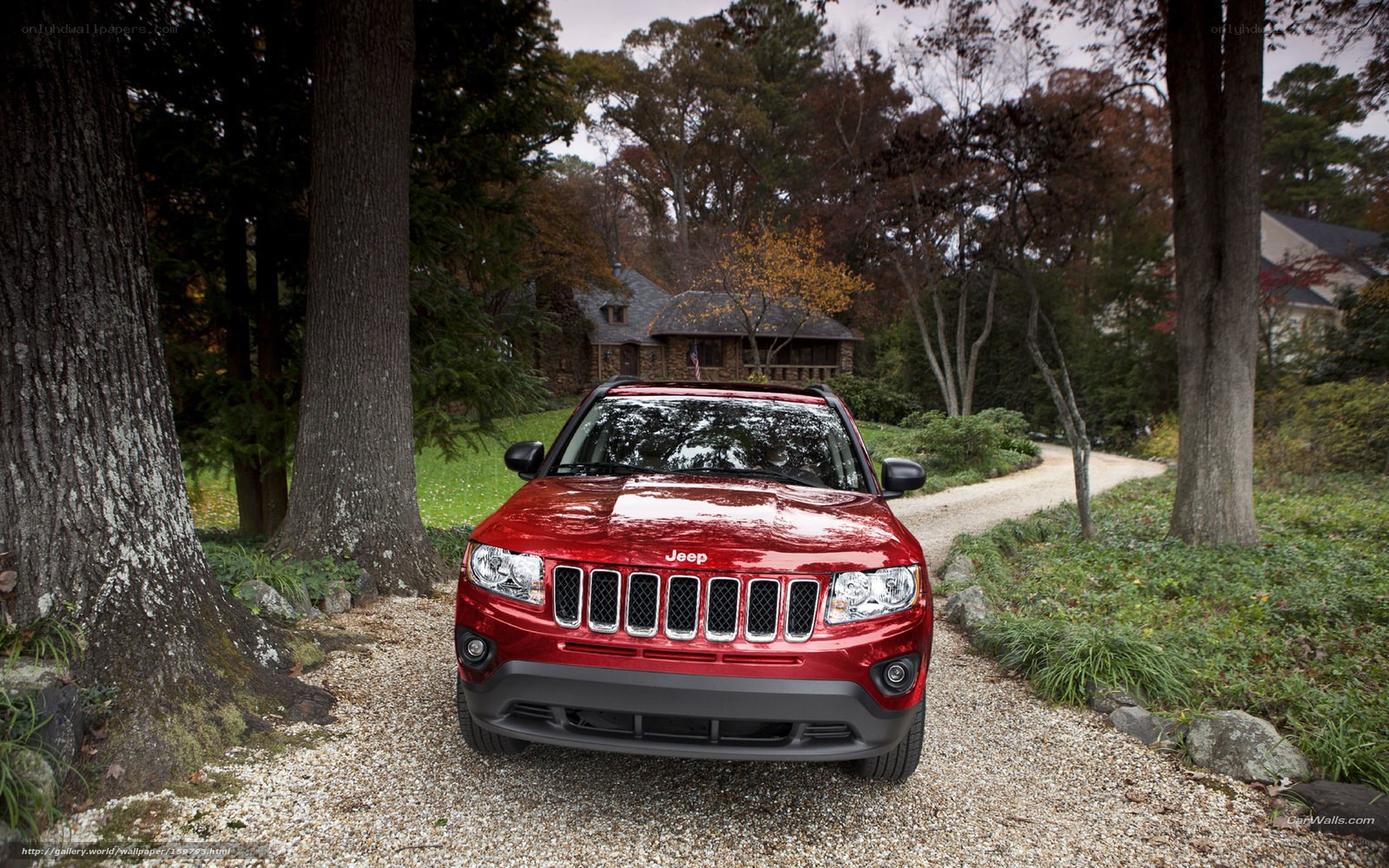 Red Jeep Compass on gravel path