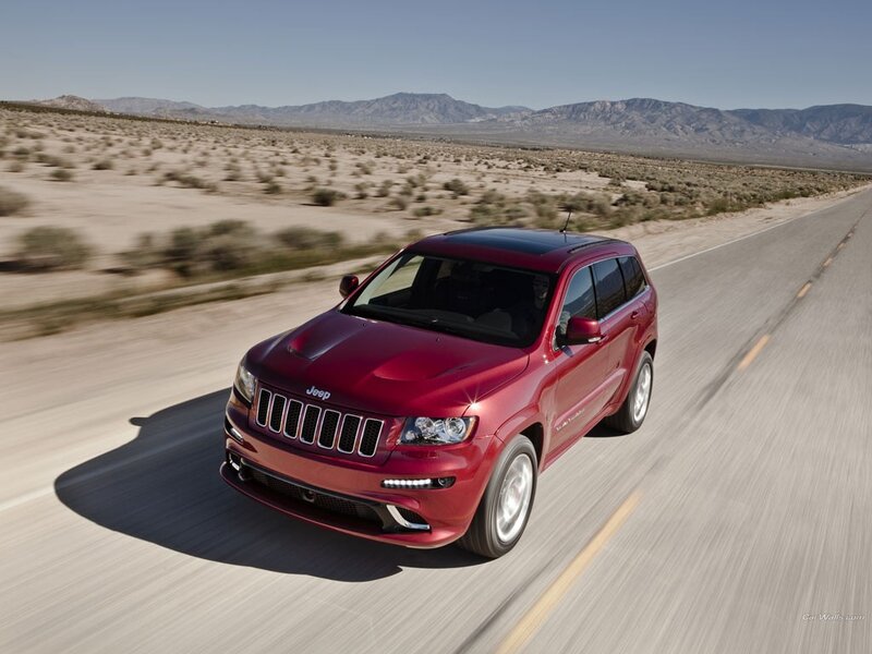 Red Jeep Grand Cherokee driving