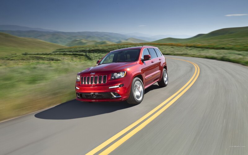 Red Jeep Grand Cherokee driving