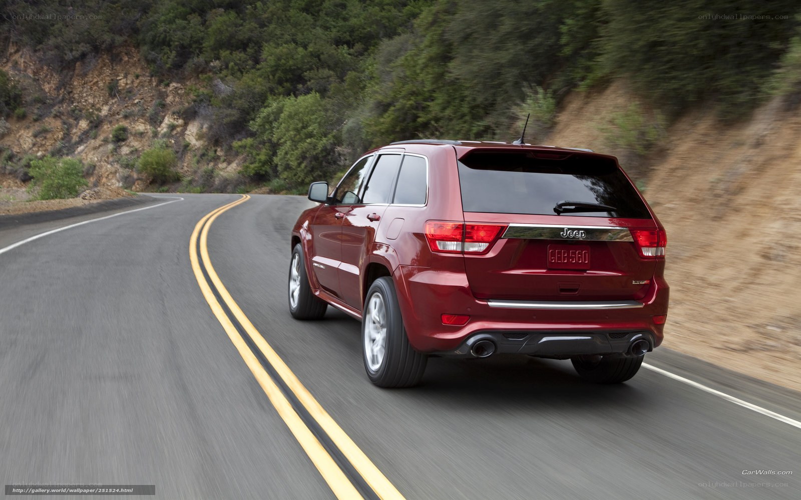 Red Jeep Grand Cherokee driving