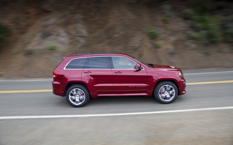 Red Jeep Grand Cherokee in motion