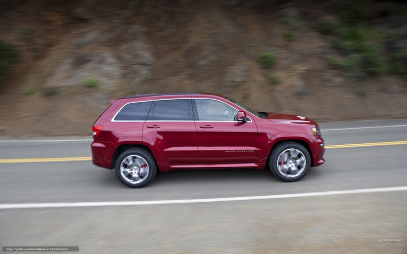 Red Jeep Grand Cherokee in motion