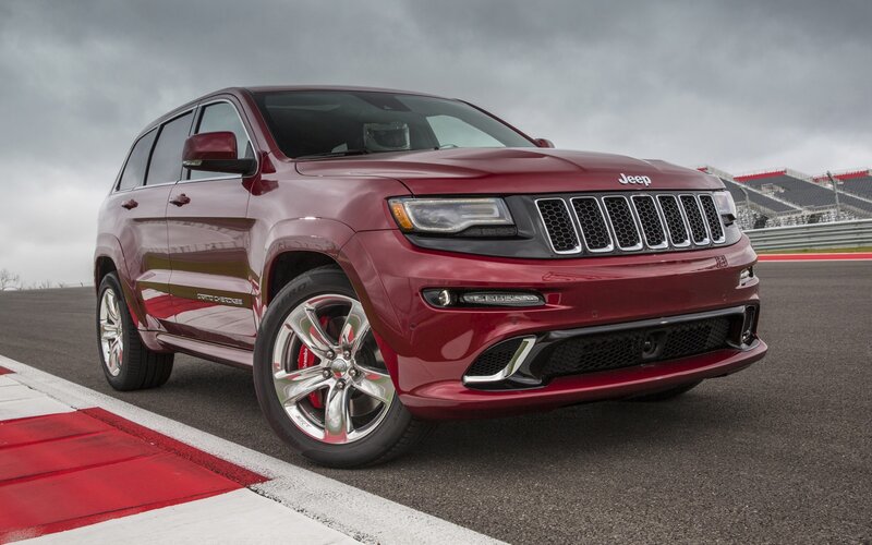 Red Jeep Grand Cherokee on racetrack