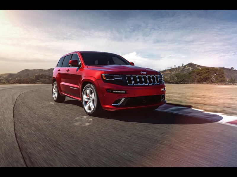 Red Jeep Grand Cherokee on track