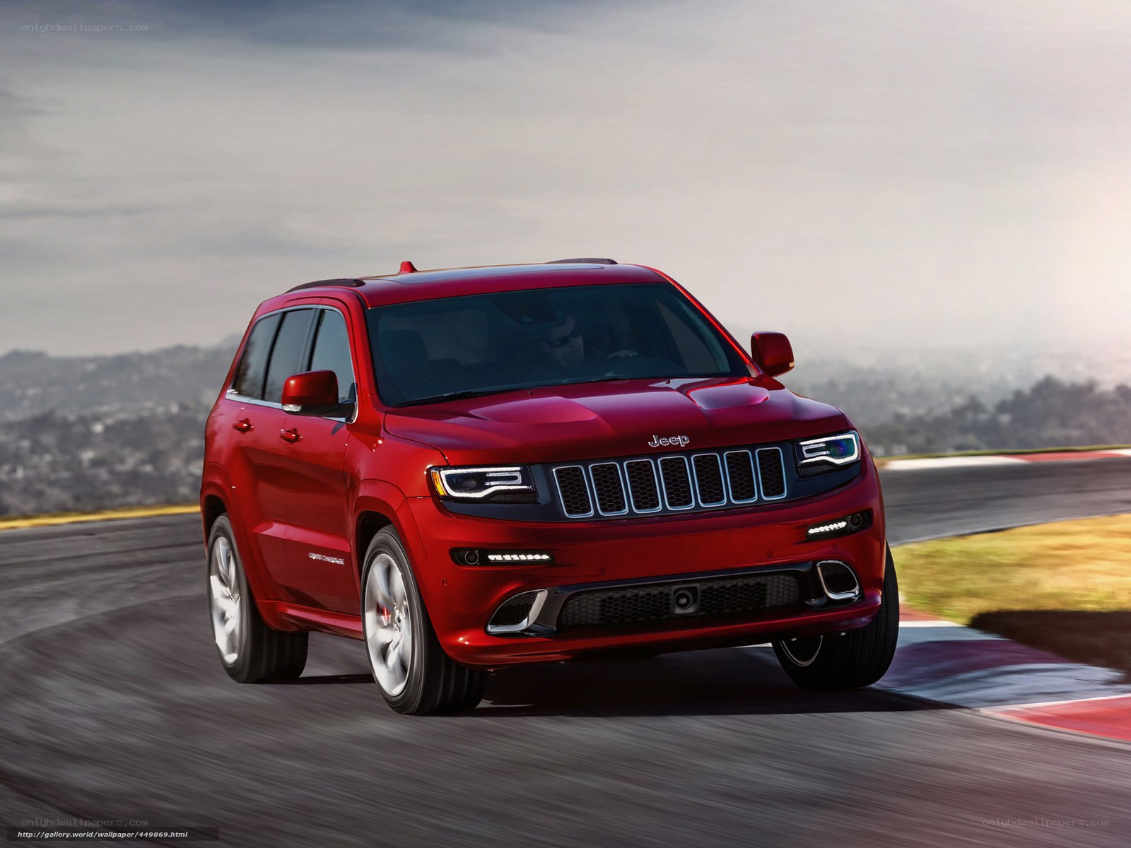Red Jeep Grand Cherokee on track