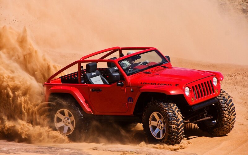Red Jeep in Sand Dunes