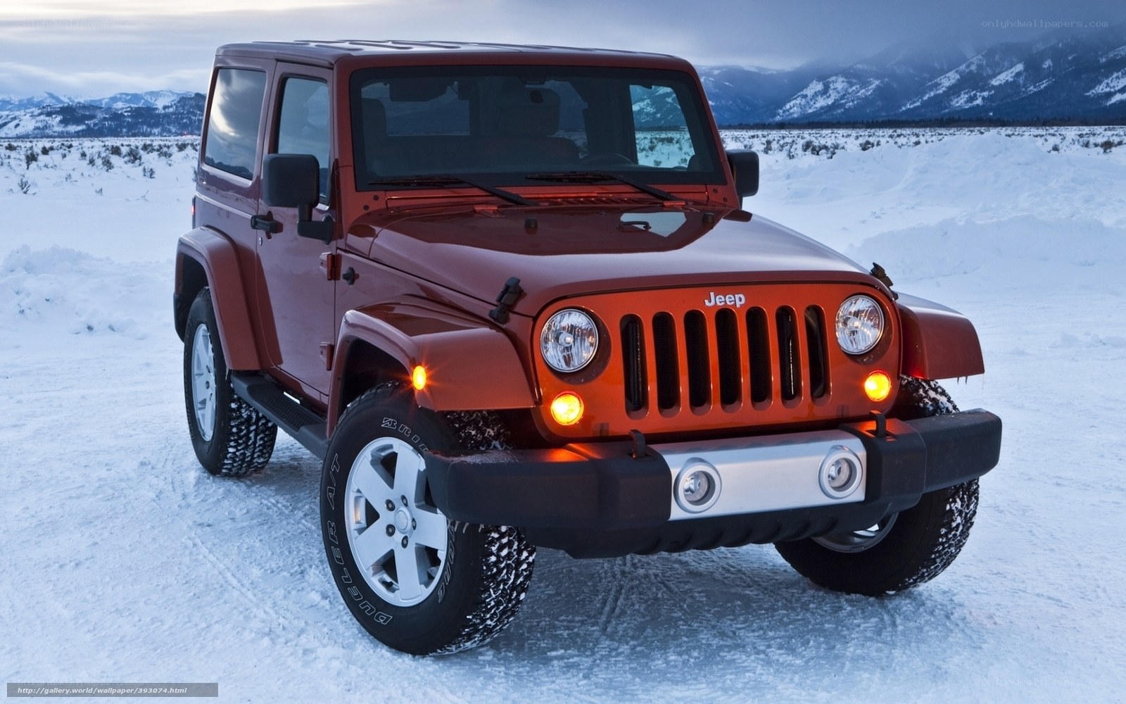 Red Jeep in snowy landscape