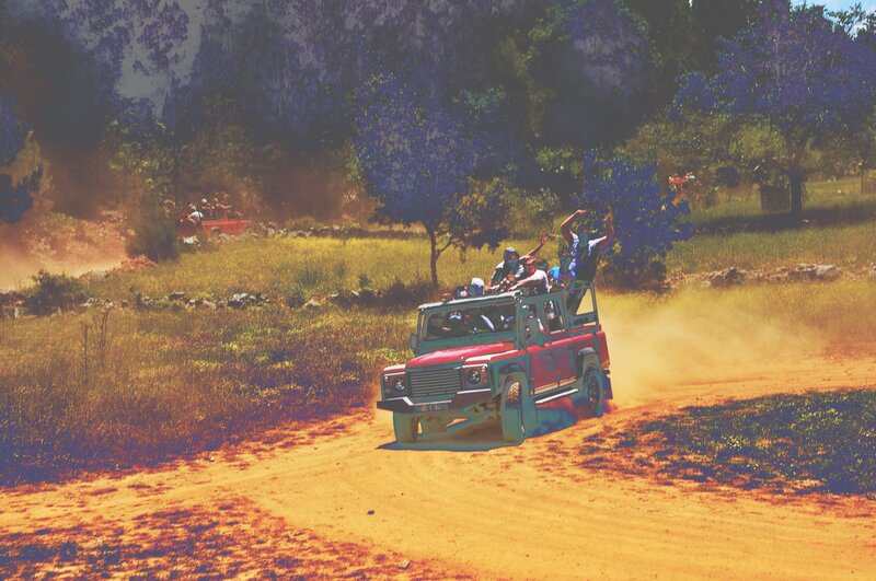 Red Jeep on Dirt Road