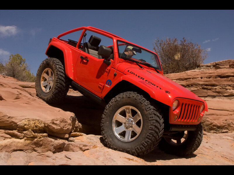 Red Jeep on Rocks — Adventurous