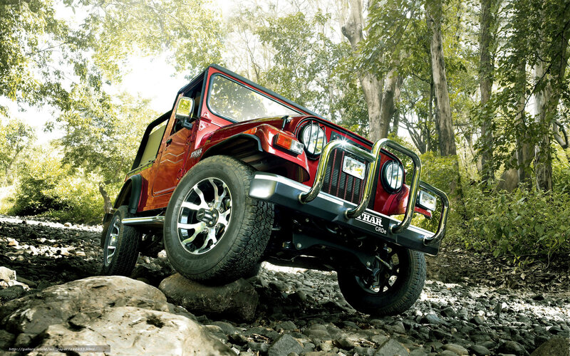 Red Jeep on Rocks