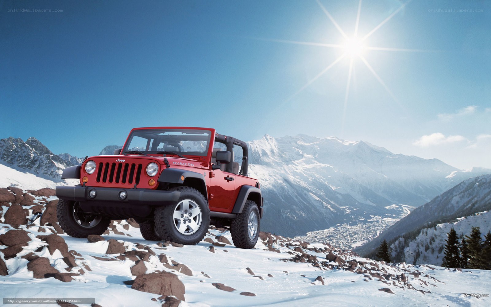 Red Jeep on snowy mountain