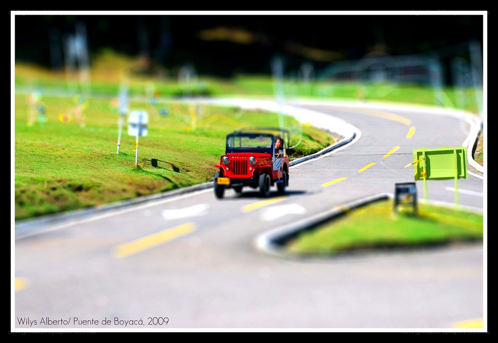 Red Jeep on Winding Road