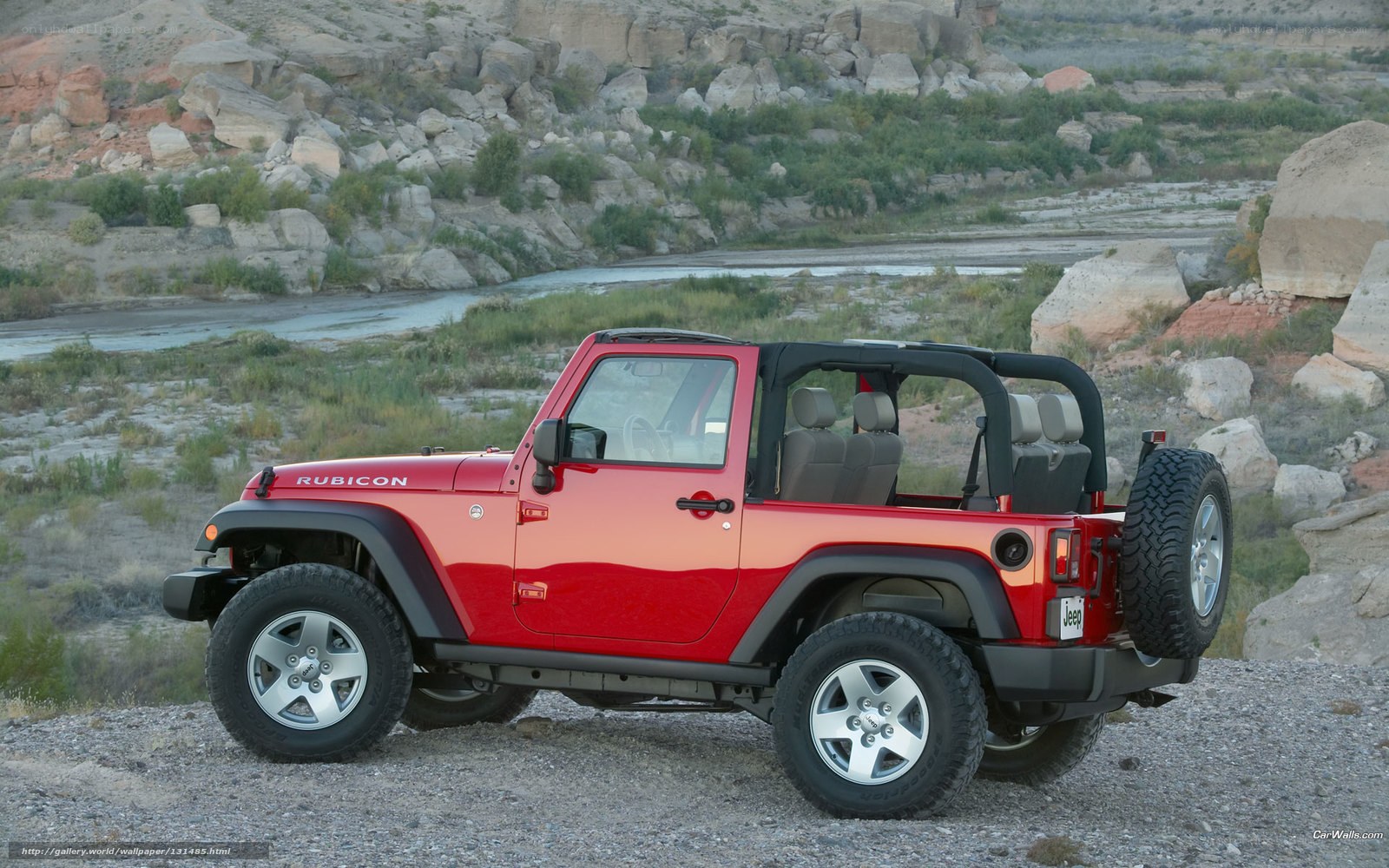 Red Jeep Rubicon in desert