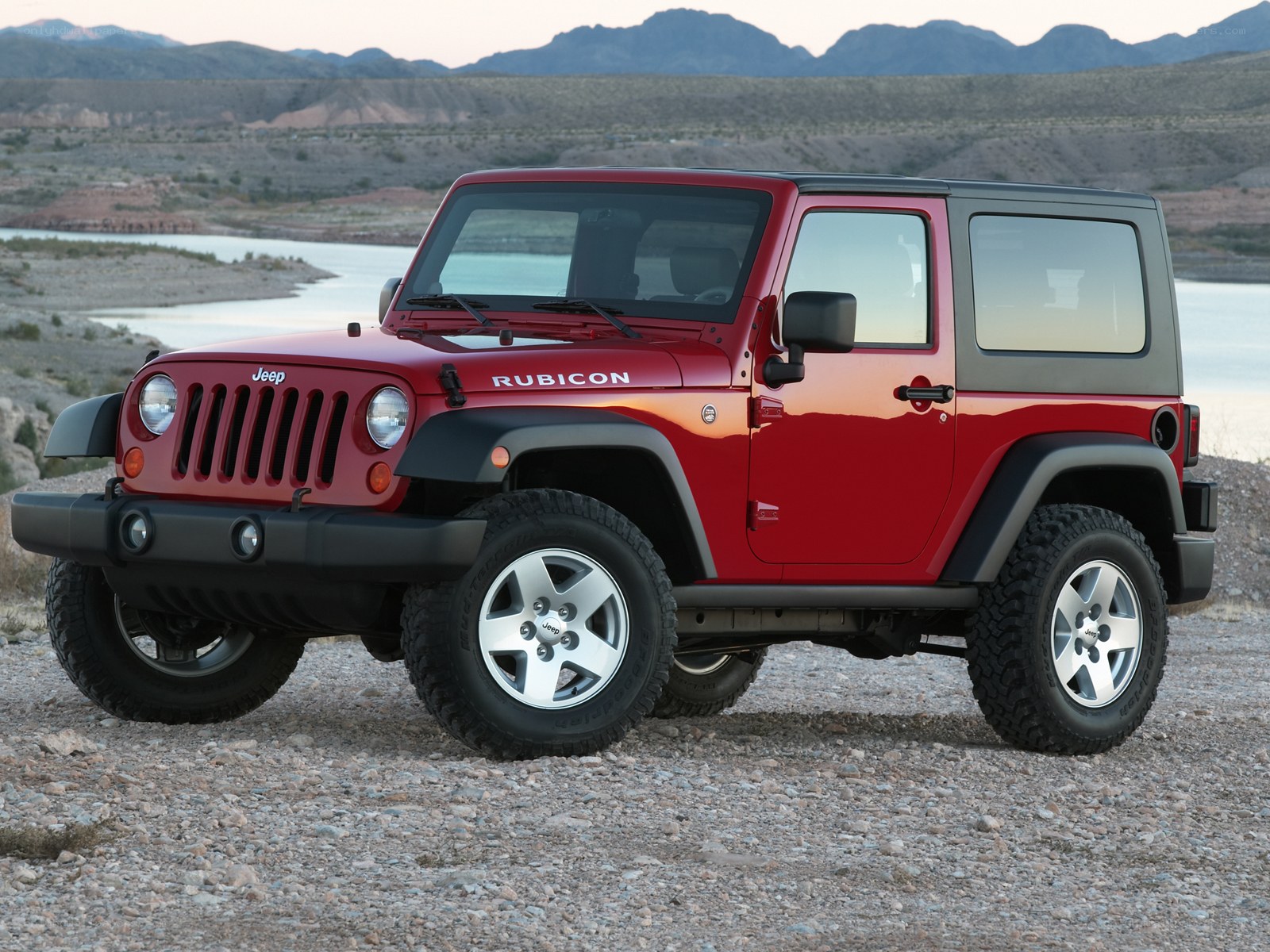 Red Jeep Rubicon in desert