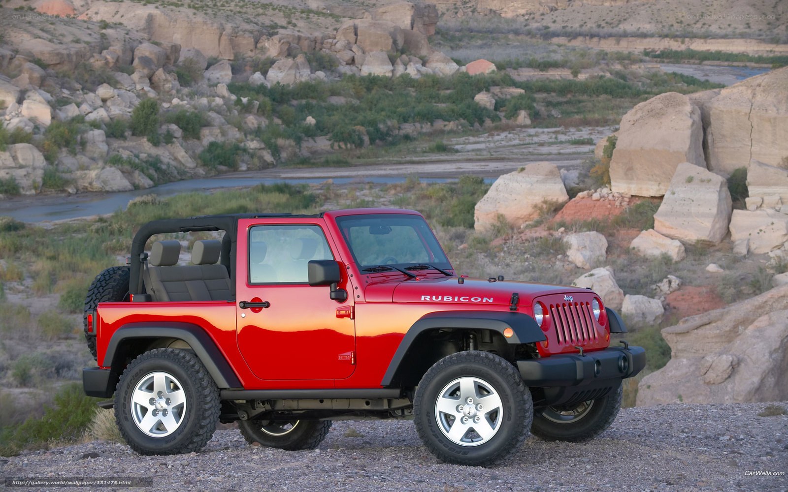 Red Jeep Rubicon in desert