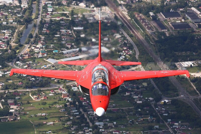 Red Jet Aircraft — Dynamic, Afternoon, Photograph, Town
