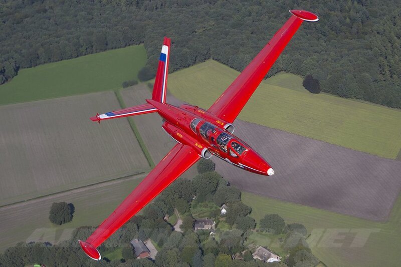 Red Jet Aircraft in Flight — Dynamic