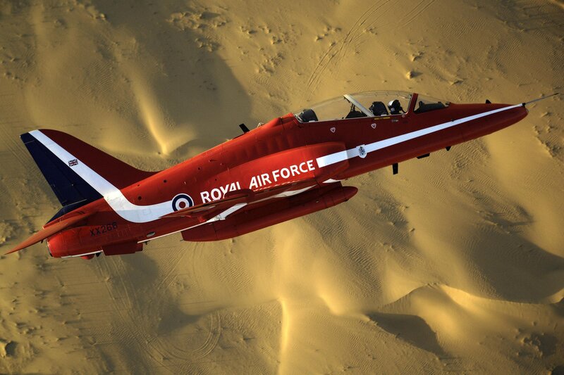 Red Jet Flying over Desert — Dramatic
