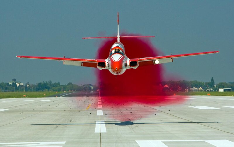 Red Jet on Runway — Dramatic