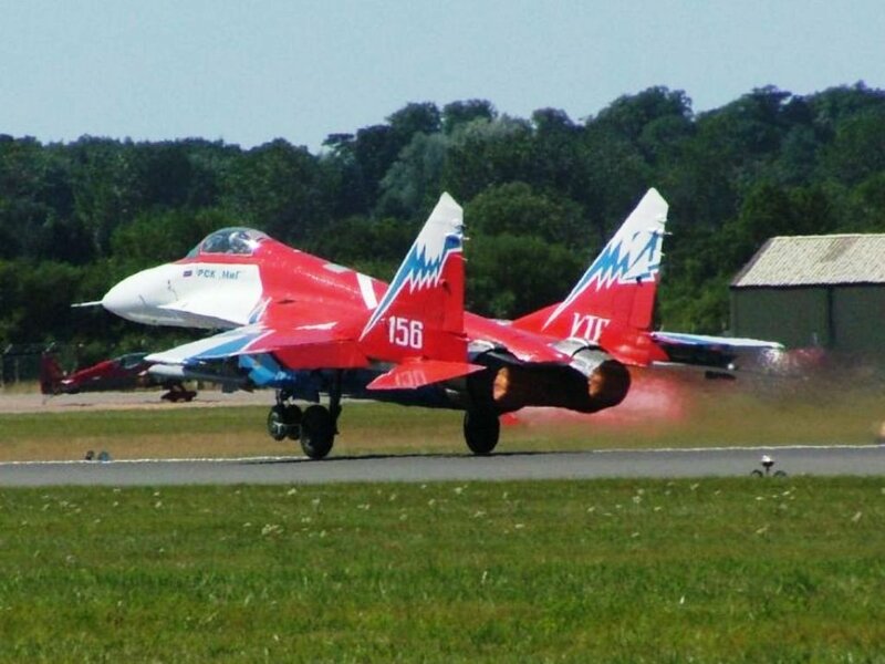 Red jet on runway