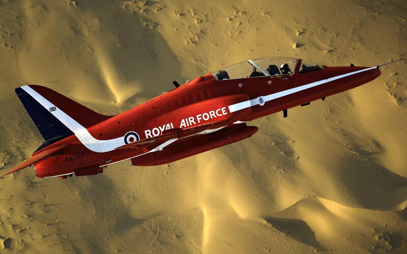 Red Jet over Desert