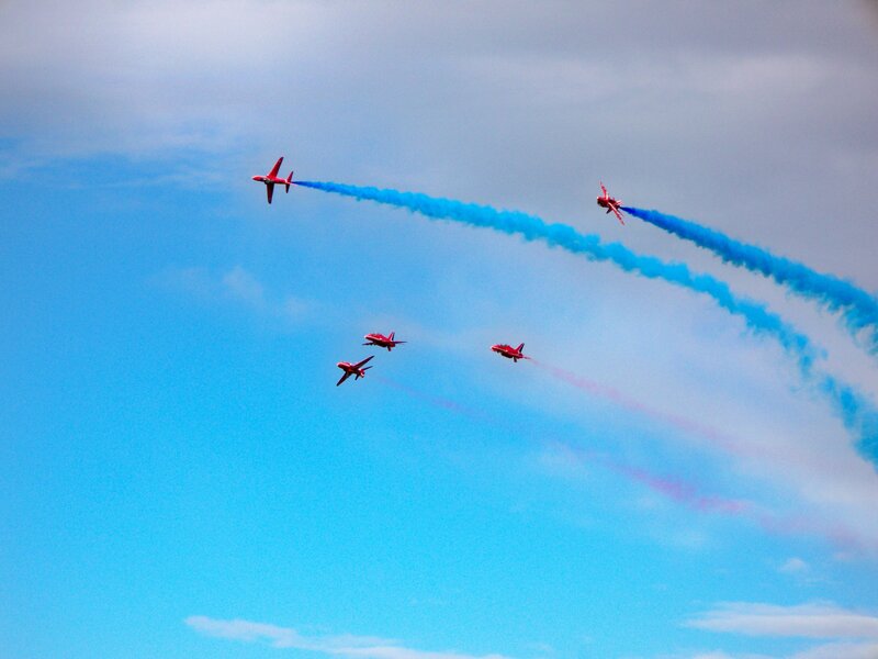 Red jets performing aerial display
