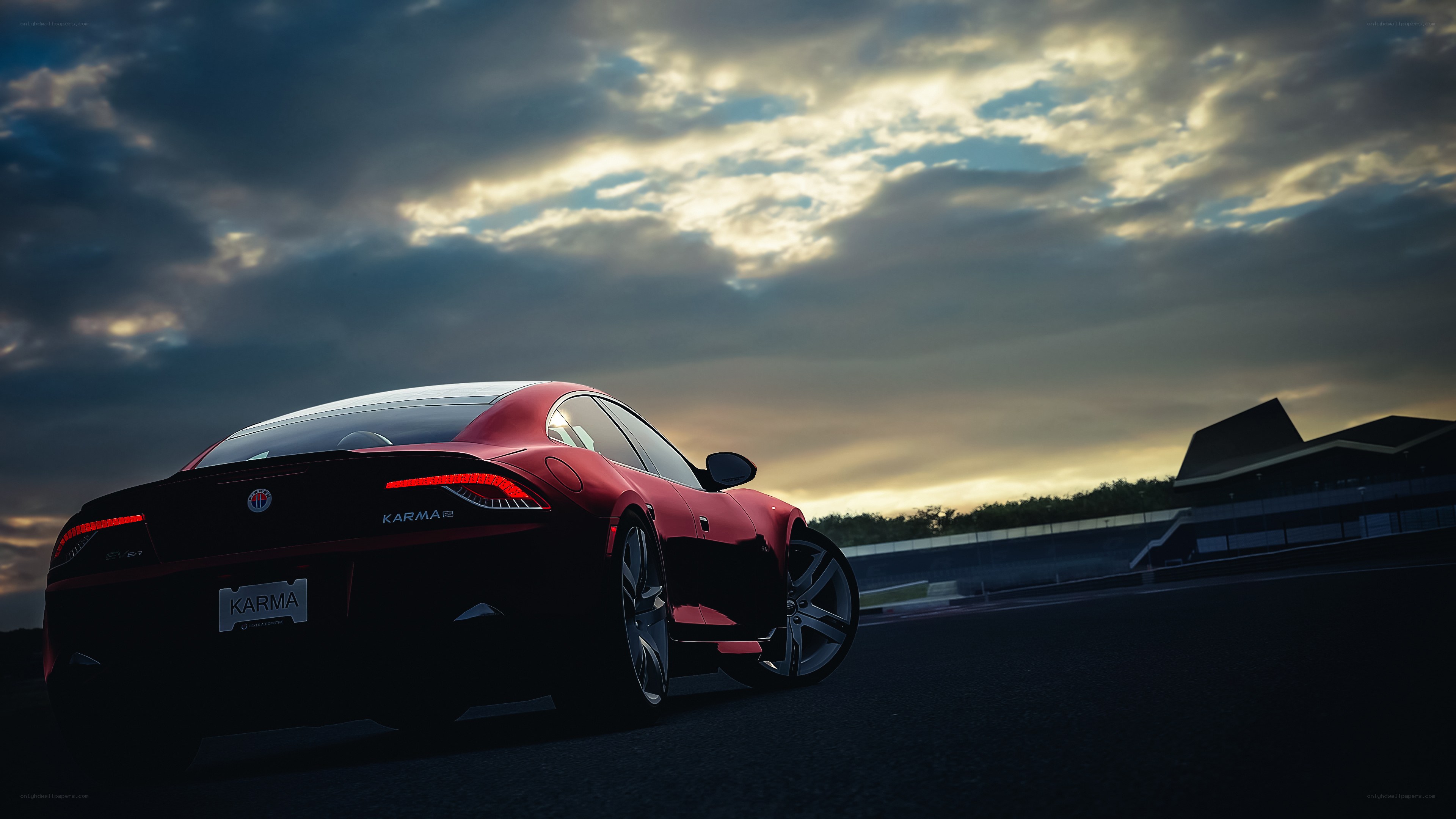 Red Karma sports car on track