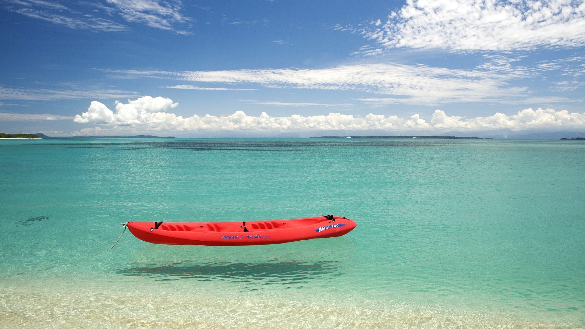 Red kayak on turquoise water