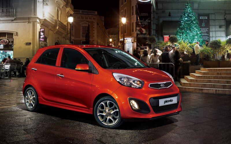 Red Kia Picanto on city street