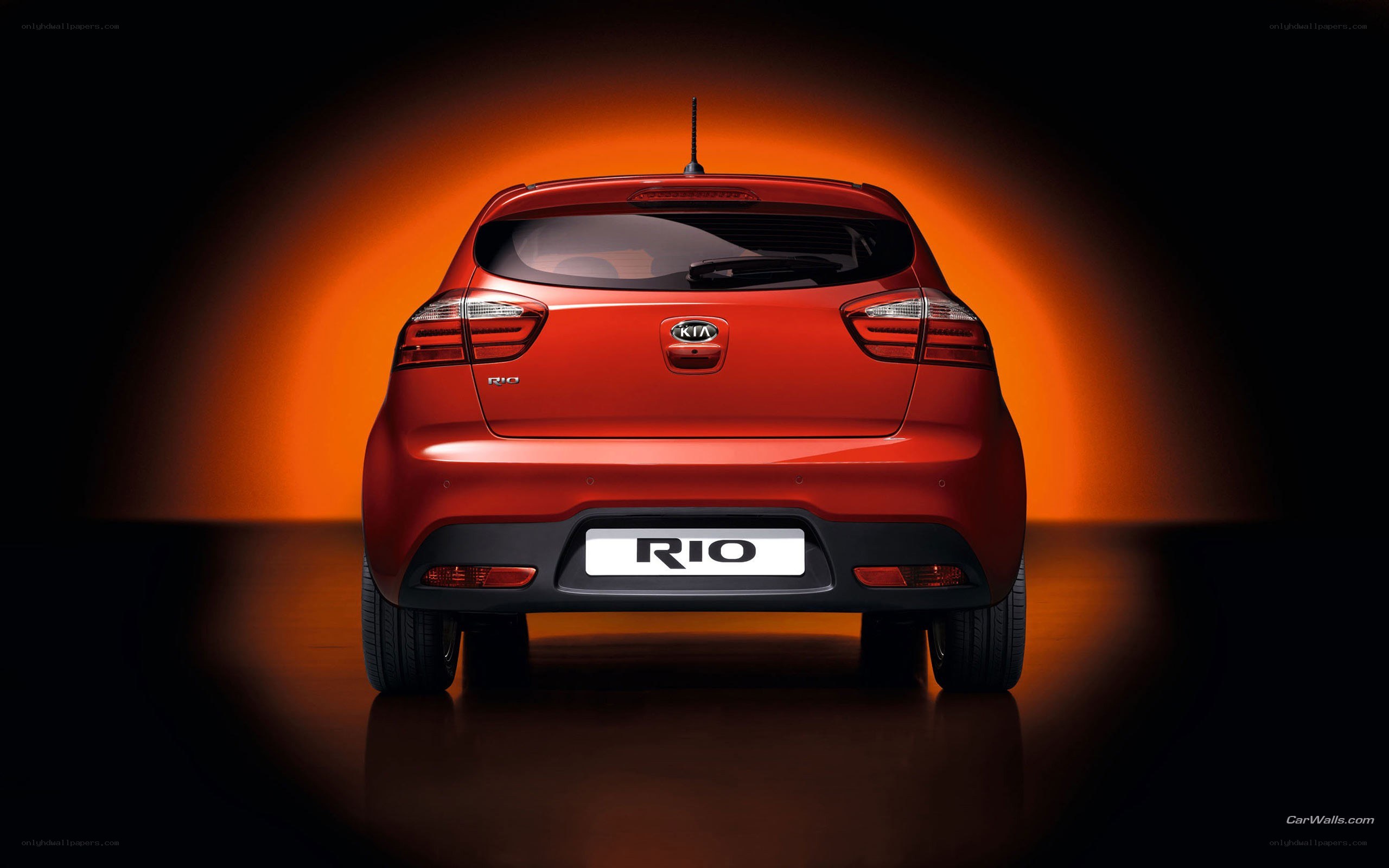 Red Kia Rio rear view