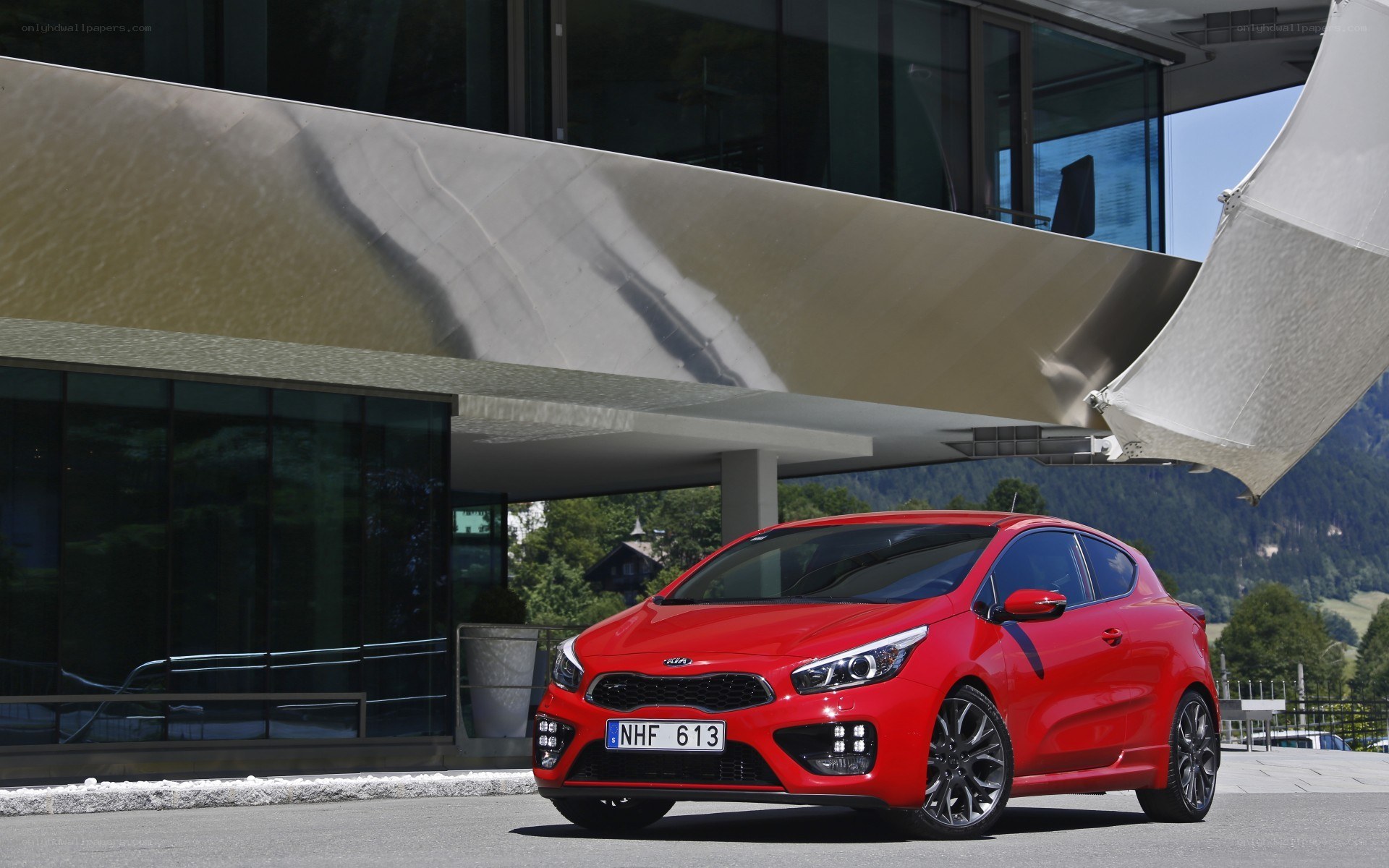 Red Kia Sportage parked outside