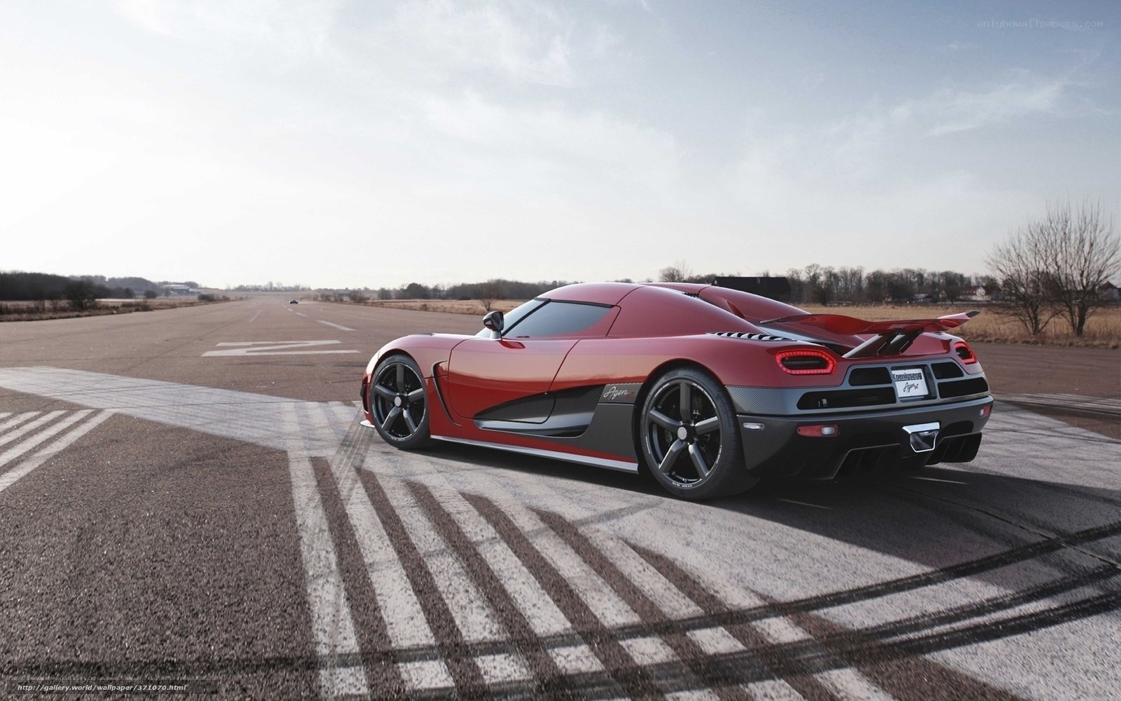 Red Koenigsegg Agera on runway