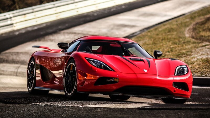 Red Koenigsegg on racetrack