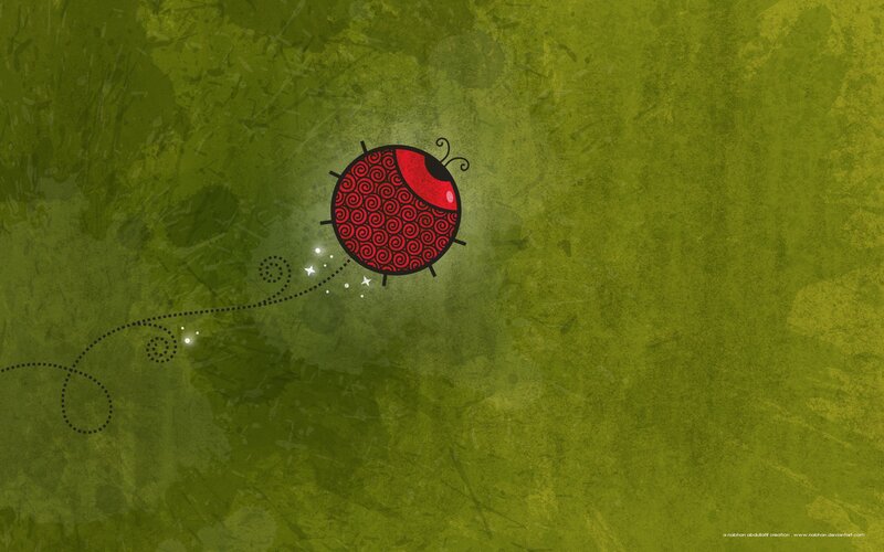 Red ladybug on green background