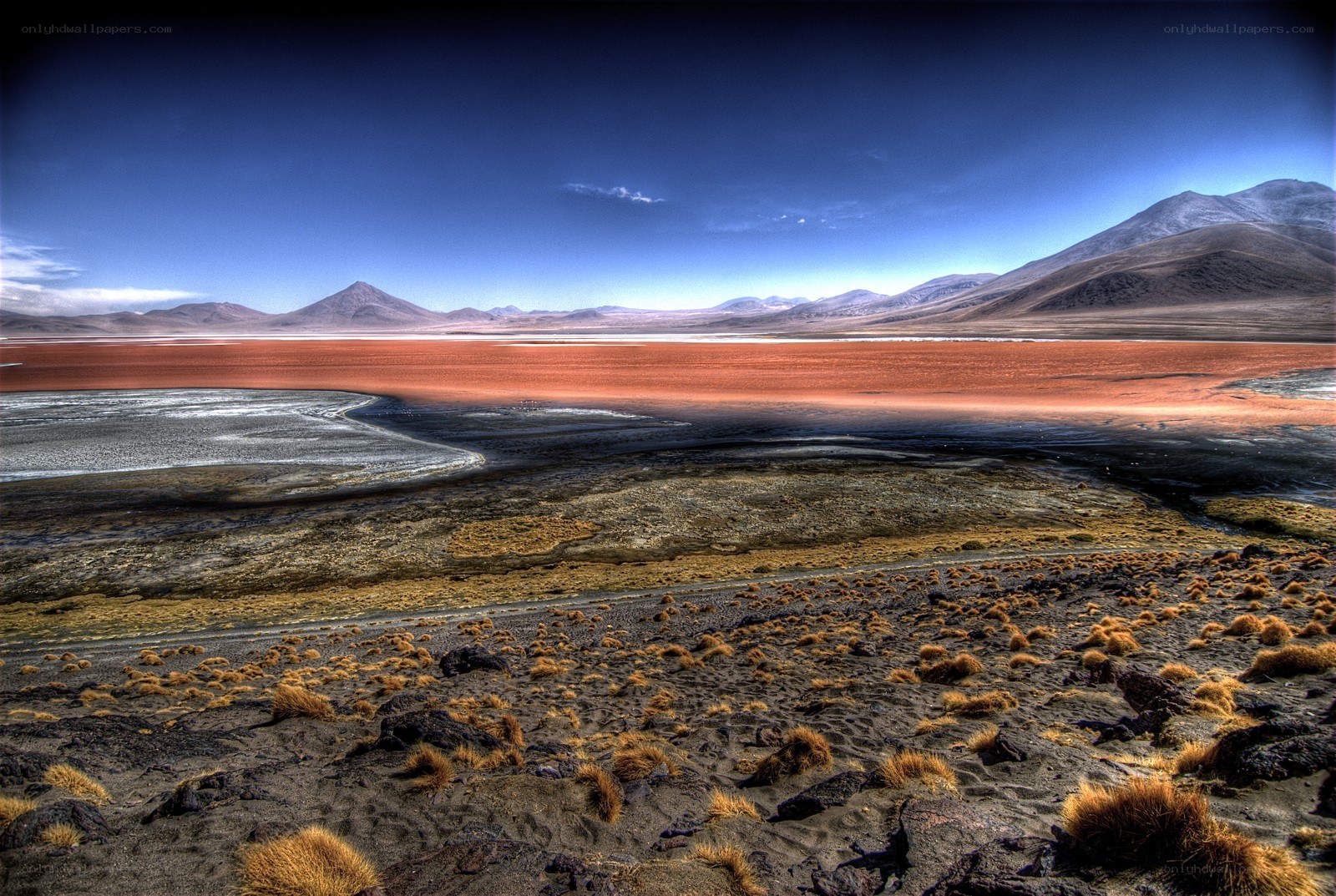 Red lake in arid landscape