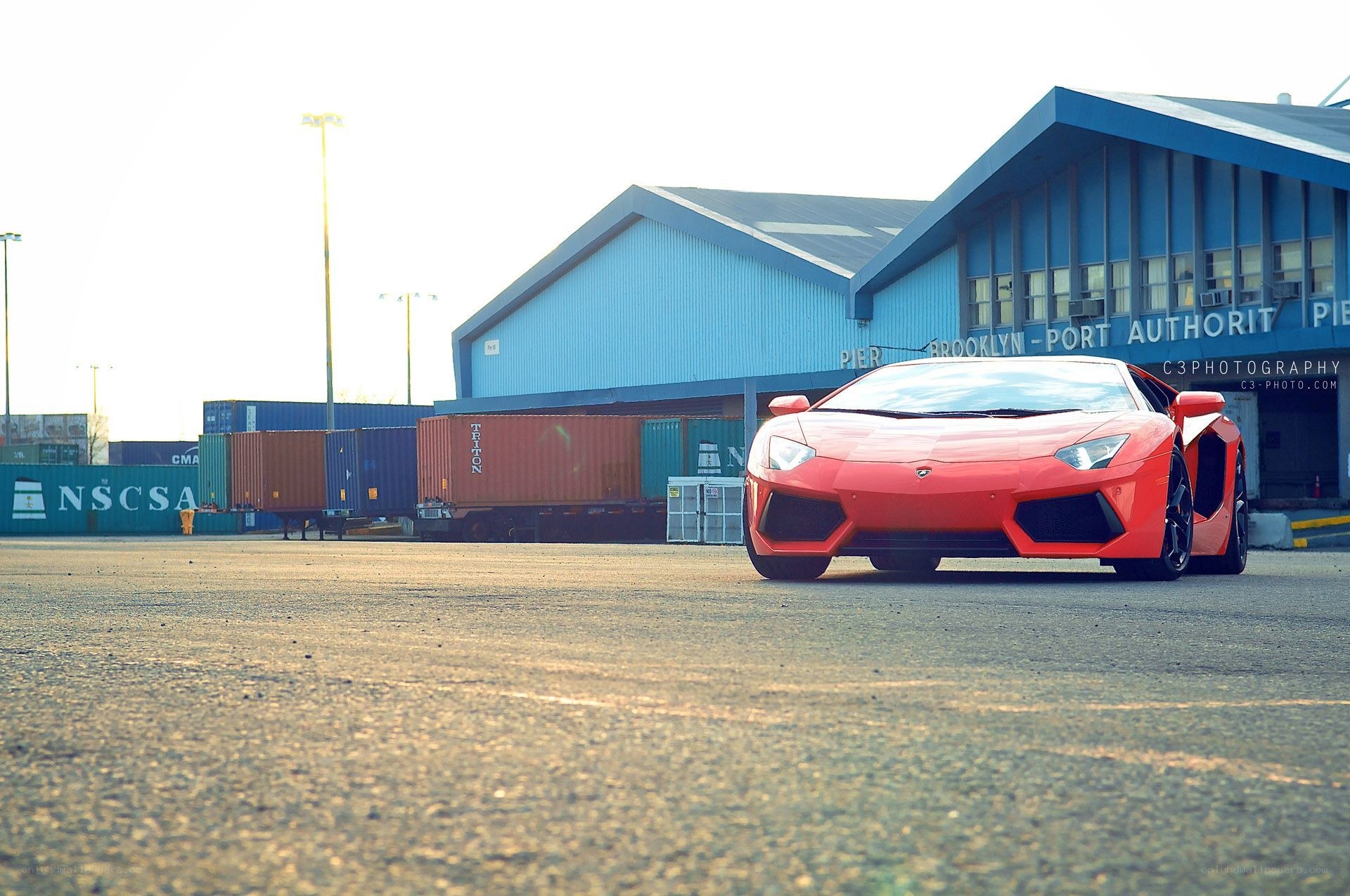 Red Lamborghini at a port