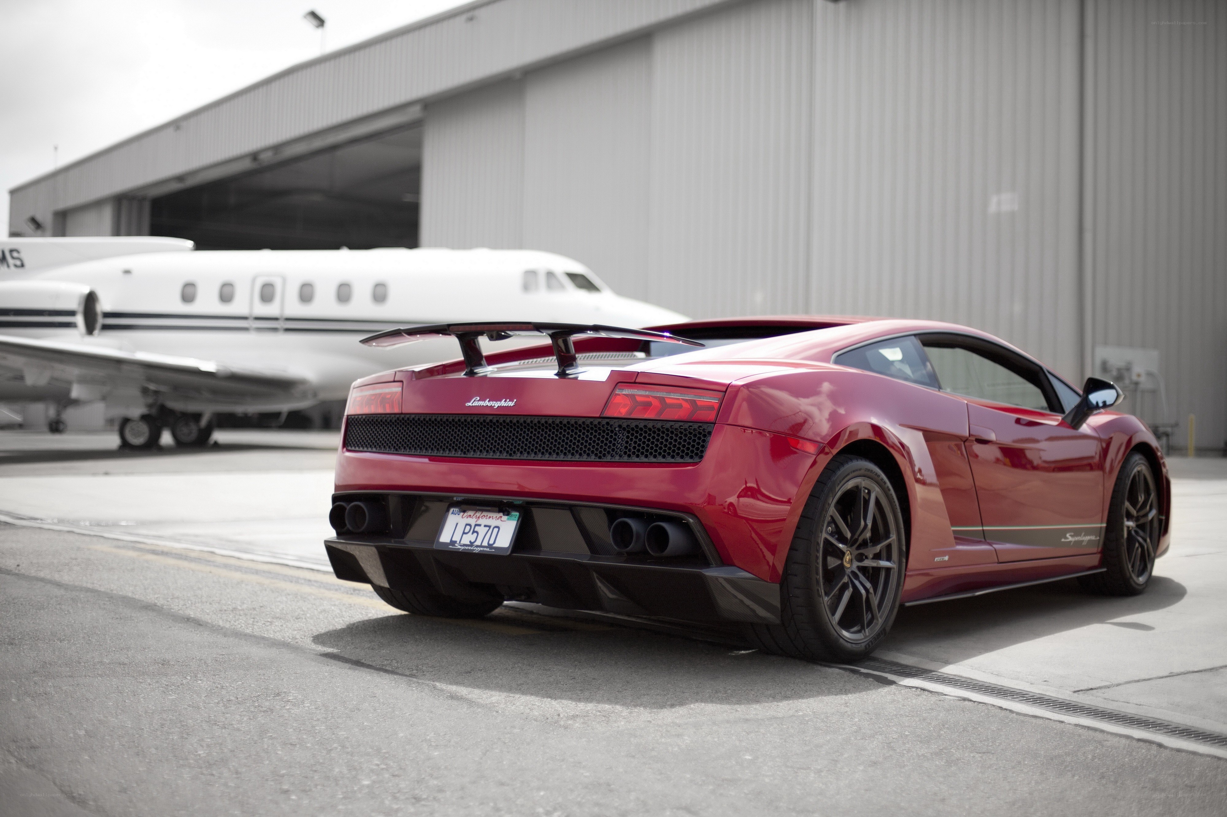 Red Lamborghini at airport