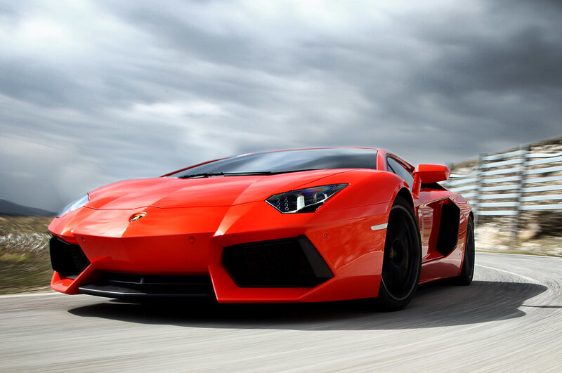 Red Lamborghini Aventador in motion
