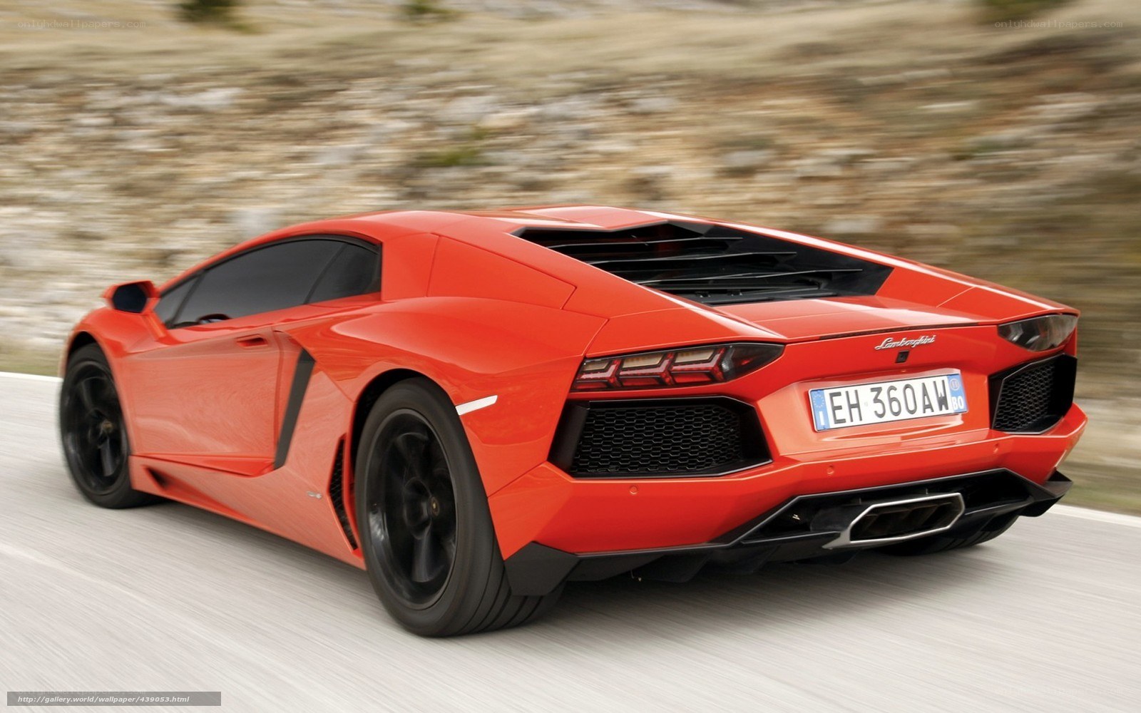 Red Lamborghini Aventador in motion