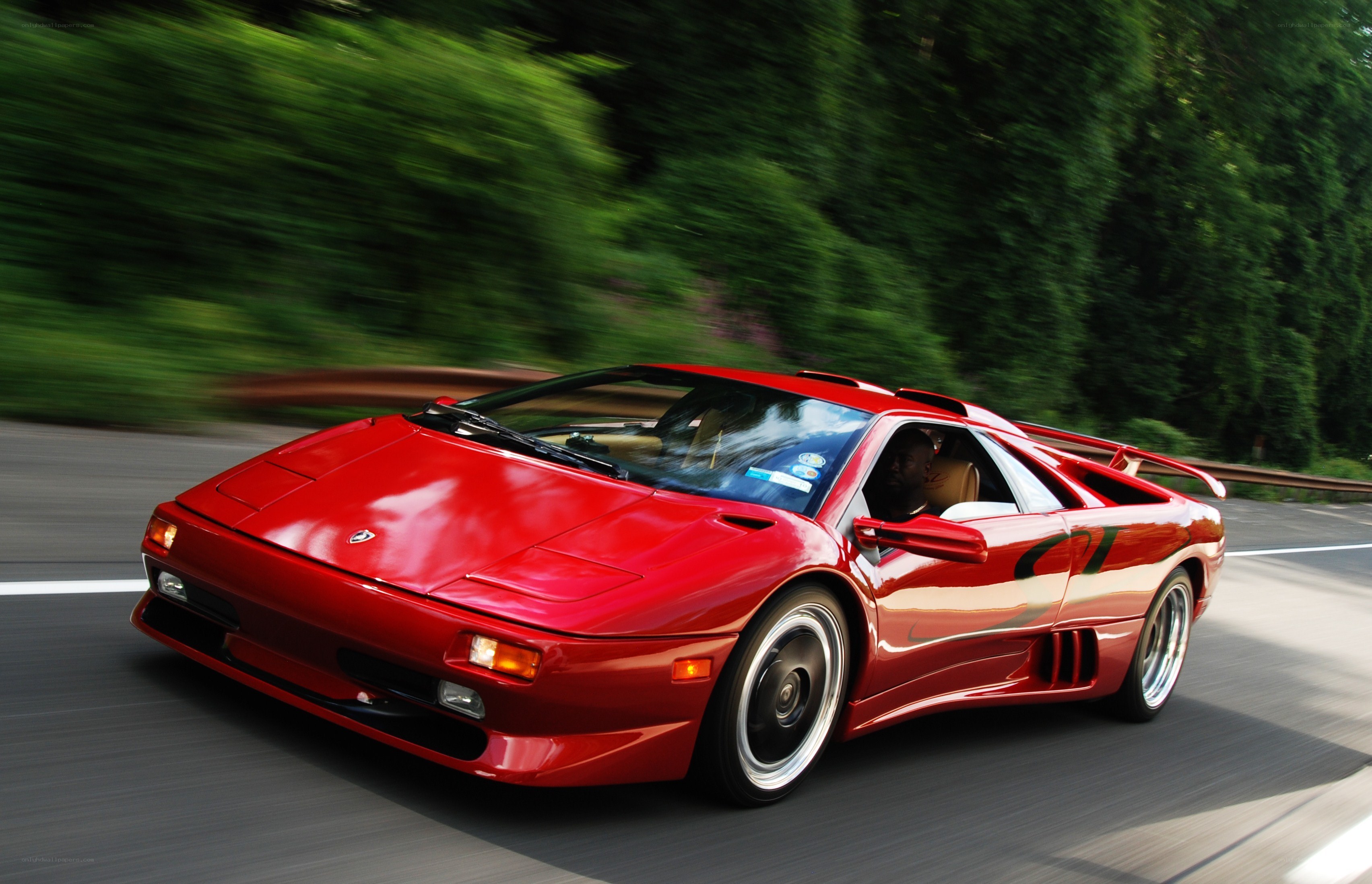 Red Lamborghini Diablo on a road