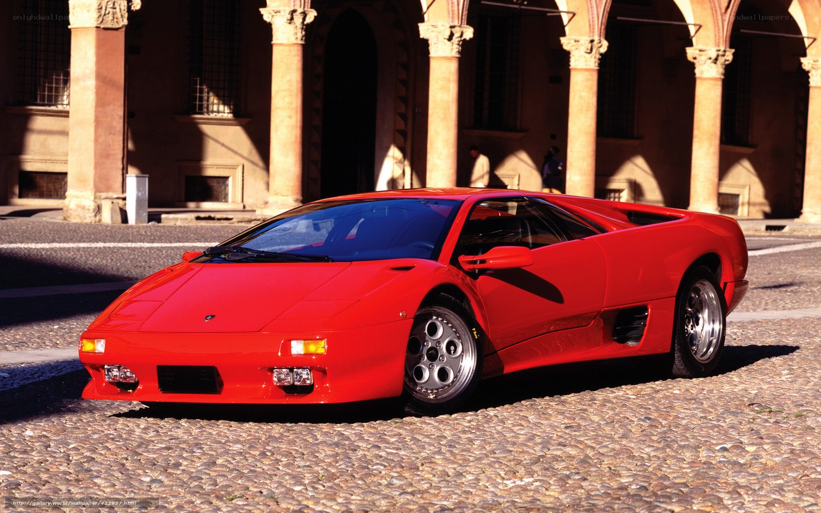 Red Lamborghini Diablo on cobblestones