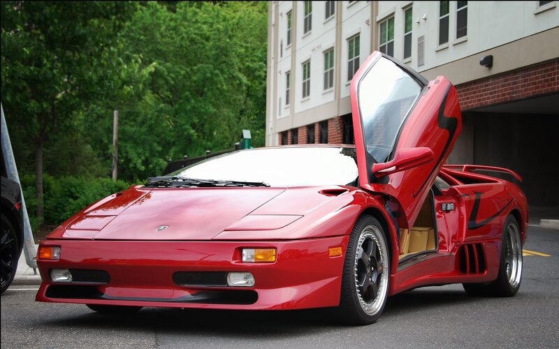 Red Lamborghini Diablo with doors open