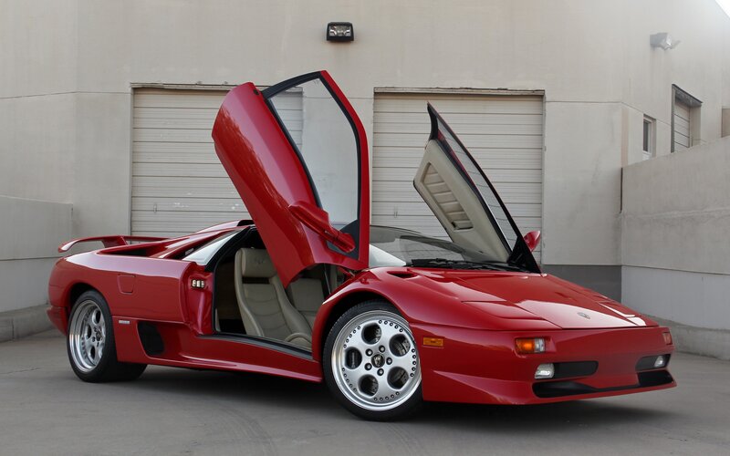Red Lamborghini Diablo with doors open