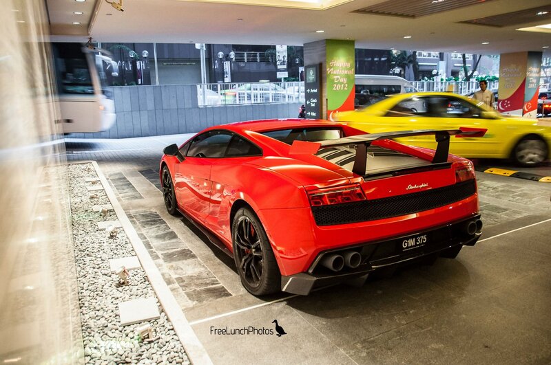 Red Lamborghini in a parking garage