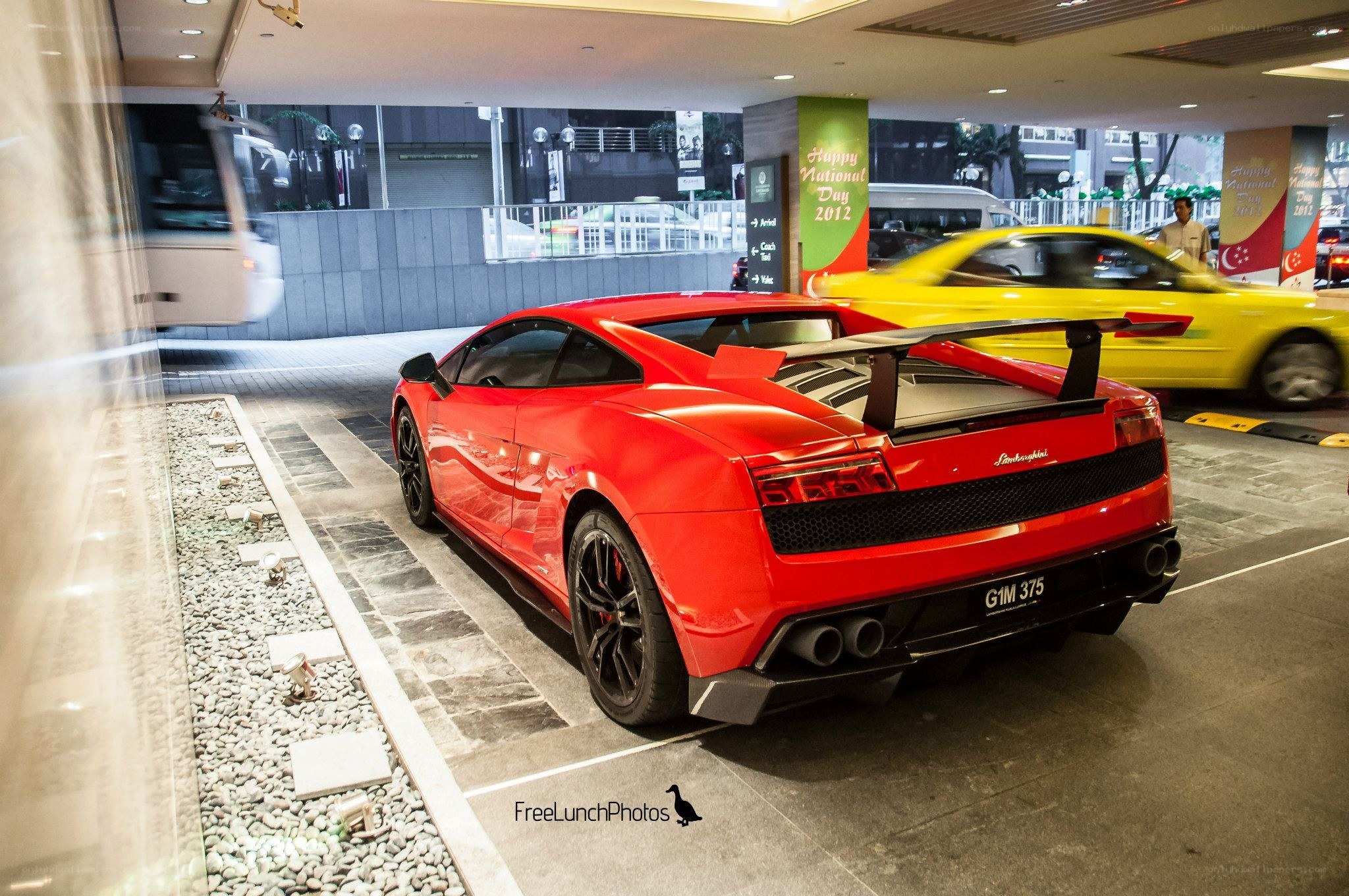 Red Lamborghini in a parking garage
