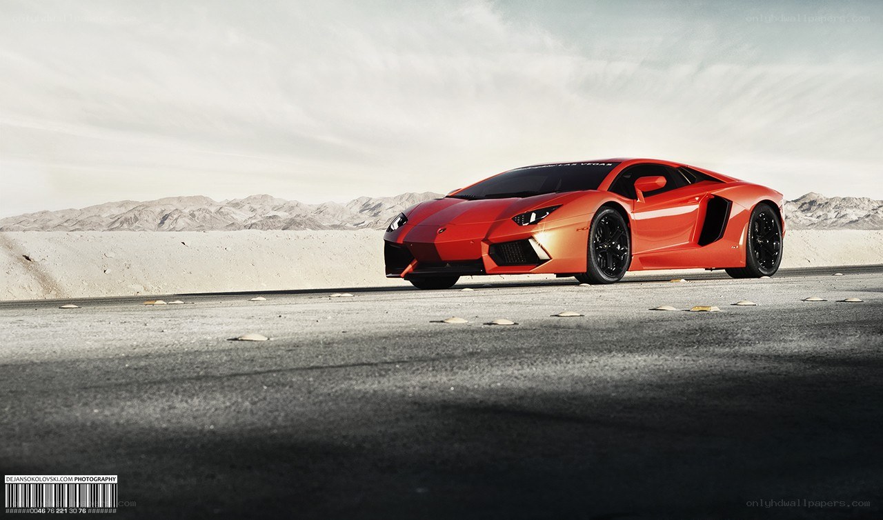 Red Lamborghini in desert