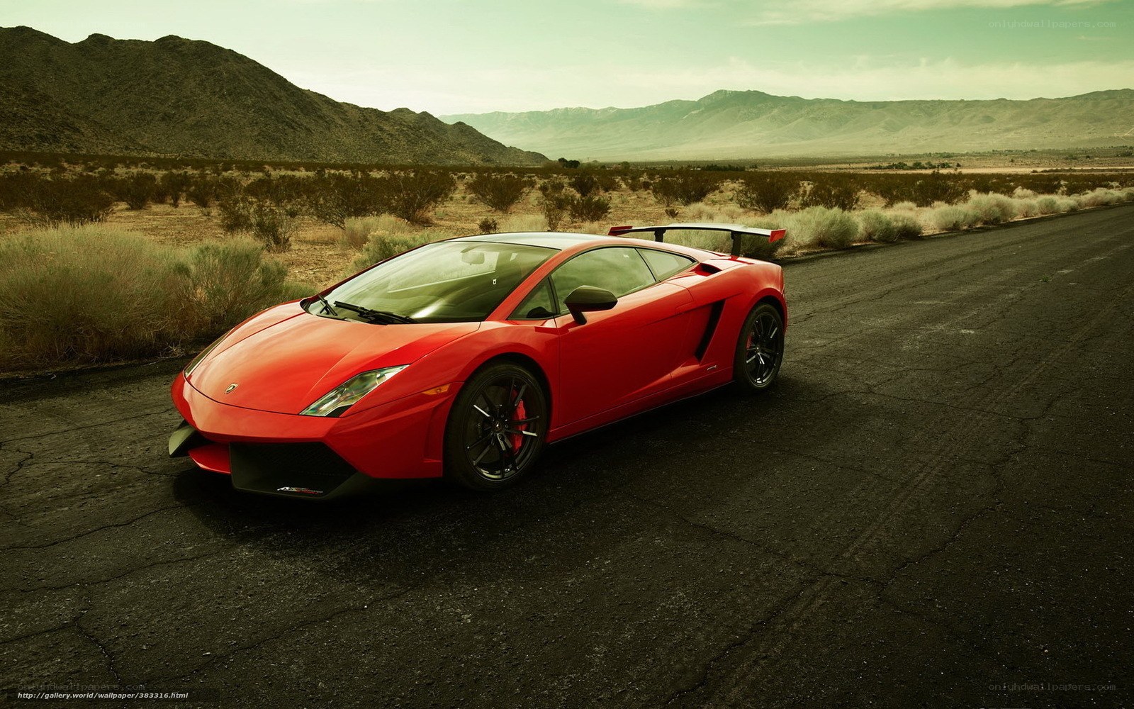 Red Lamborghini in desert landscape