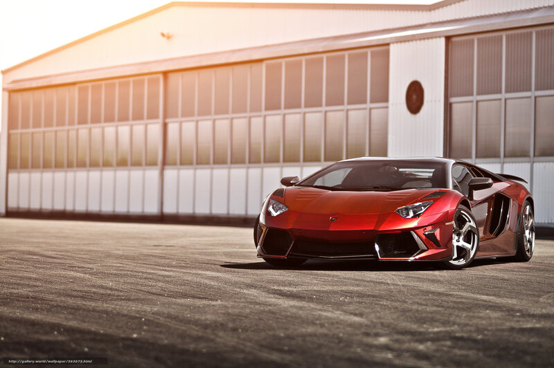 Red Lamborghini in front of hangar