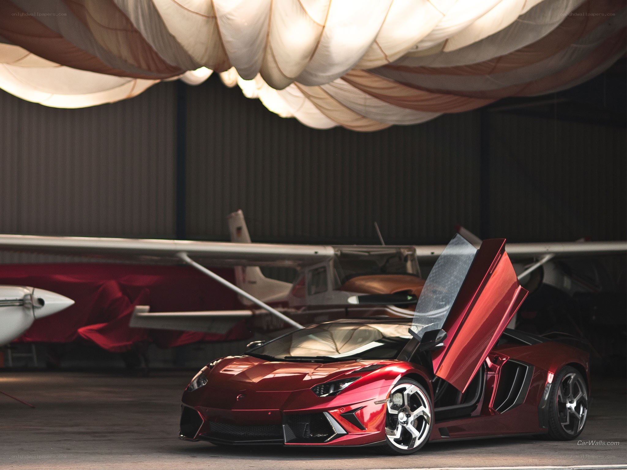 Red Lamborghini in hangar